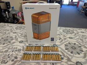 Olight 977261692067 Ostation X Brand New Sealed In Box Aa Automatic Charger With 32 Batteries