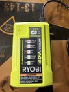 Ryobi 40V Lithium Battery Charger OP403VNM. Fixed Price $14.99.
