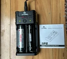 Xtar SP2 Dual Bay Battery Charger With Two Lithium-ion Batteries. Fixed Price $34.99.