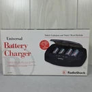 Vintage Radio Shack Universal Battery Charger- New Box. Fixed Price $14.69.