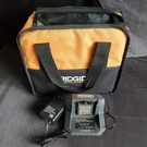 New Ridgid 18V Lithium-ion Battery Charger R86093 With Slightly Used Bag. Fixed Price $14.99.