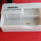 Pentax D-BC20 Battery Charger For Camera, White, 240V, Plastic. Fixed Price $5.00.